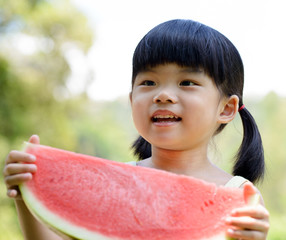 Smiling child hold watermelon