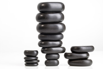 Fototapeta na wymiar black pebble stones for spa massage