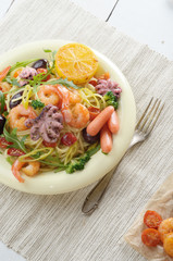 Seafood spaghetti pasta dish with octopus and shrimps