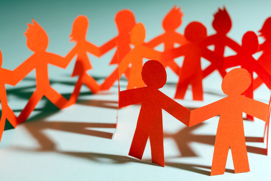 Paper team linked together partnership concept