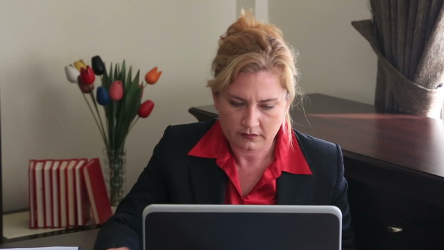 Businesswoman having neck pain