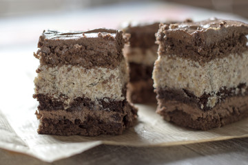 Delicious chocolate cake on table close-up
