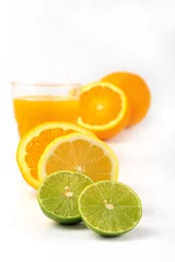 Foto op Plexiglas Orange juice and slices of orange and lemonade isolated on white © maya1313