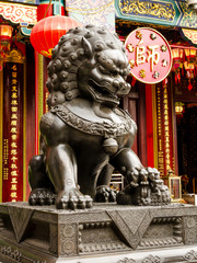 Fototapeta na wymiar A statue of chinese imperial Lion made from stone