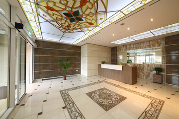 The elegant front with stained glass ceilings and granite floor