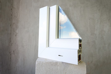 Sample PVC window stands on a concrete block