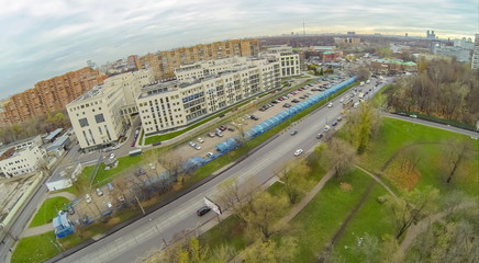 Obraz premium long car parking with plastic cover near residential house