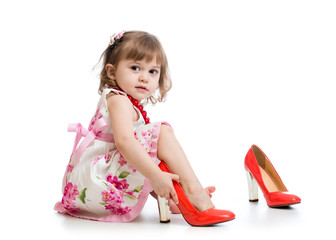 Little girl trying on mummy's shoes © Oksana Kuzmina
