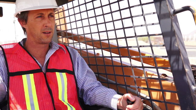 Industrial Male Worker On Skidsteer