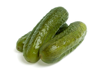 Pickled cucumbers on white background