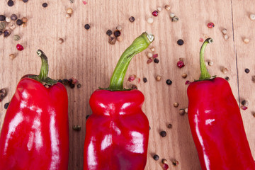 red peppers on wooden background fresh vegetables