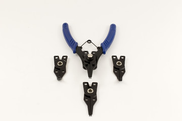 Universal snap ring pliers set on the light background