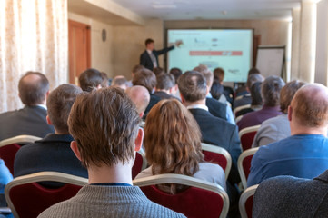 people sitting rear at the business conference