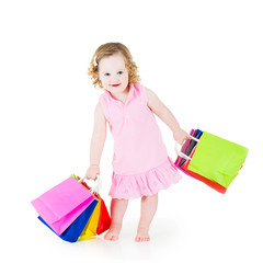 Beautiful girl with colorful bags after successful sale shopping
