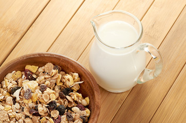 Delicious and healthy cereal in bowl with milk