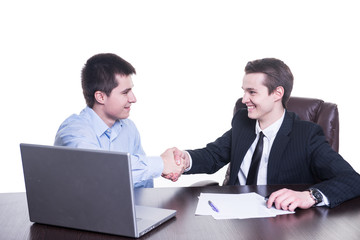 Fototapeta premium Happy businessmen shakes hands on business meeting