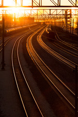 Naklejka na ściany i meble railroad station at sunset