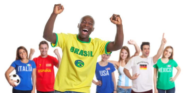 Cheering sports fan from Brazil with fans from other countries