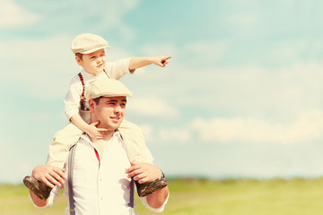 portrait of father and son in the countryside