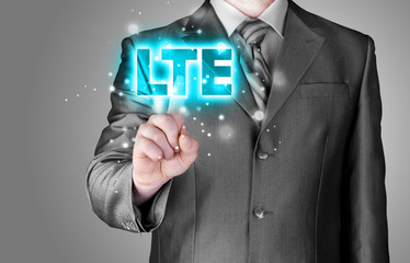 businessman is pushing his finger on lte button