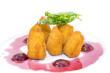 grilled cheese with berry sauce on a white background