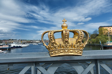 Royal crown on a Skeppsholmen bridge in Stockholm - 64160282