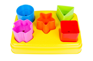 Shape sorter toy with various coloured blocks isolated
