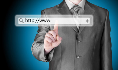 Businessman pushing virtual search bar