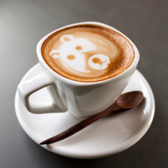 Cup of latte coffee like face bear