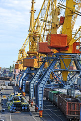Pipe stack and train under crane bridge