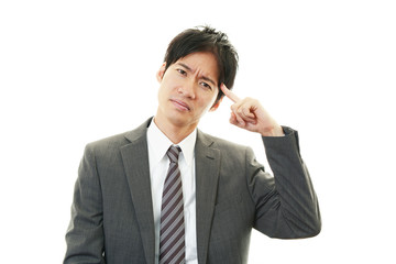 頭痛を訴えるビジネスマン