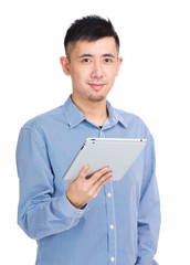 Young man using digital tablet