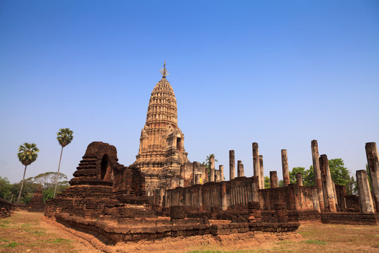 Sukhothai ruin old pagoda against blue sky