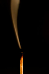 Silhouette of a burning match