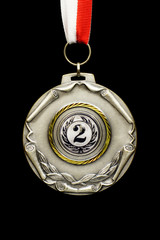 Silver medal, black background, vertical