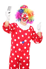 Clown taking selfie with his thumb up