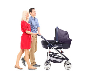 Young parents pushing a baby stroller