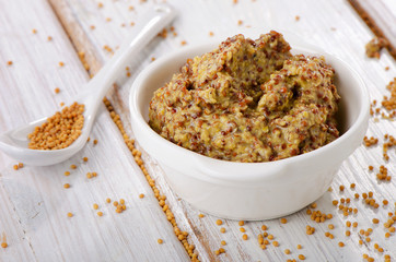 Mustard sauce on wooden table