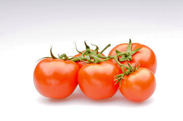 Bunch of fresh tomatoes ， Isolated on white background.