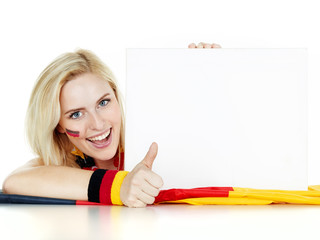 Girly soccer fan with message board shows thumb up
