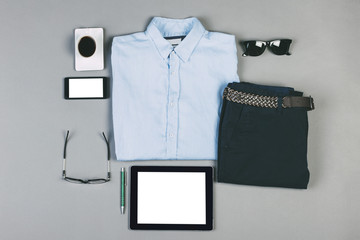 Outfit of business man on grey background.