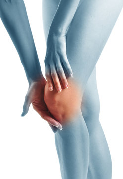 Acute pain in a woman knee. Sports trauma.