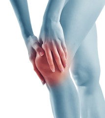 Acute pain in a woman knee. Female holding hand to knee-aches.