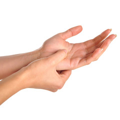 Female holding hand to spot of wrist pain.
