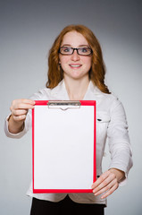 Businesswoman with notepad in the studio