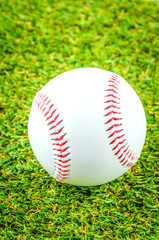 Baseball on green grass