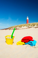 Beach with toys and lighthouse