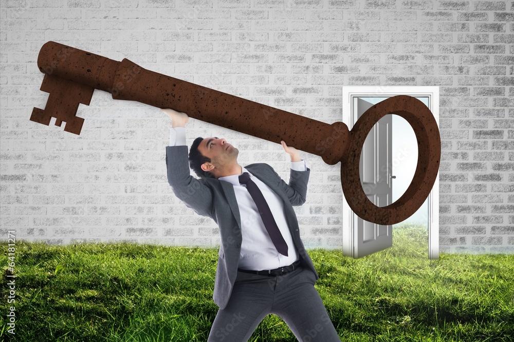 Poster Composite image of unsmiling businessman carrying large key