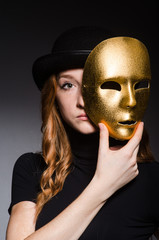 Redhead woman in hat  iwith mask in hypocrisy consept against da