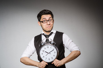 Businessman with clock in time concept